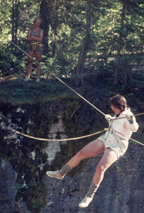 Sally Ross crossing on a rope, close-up